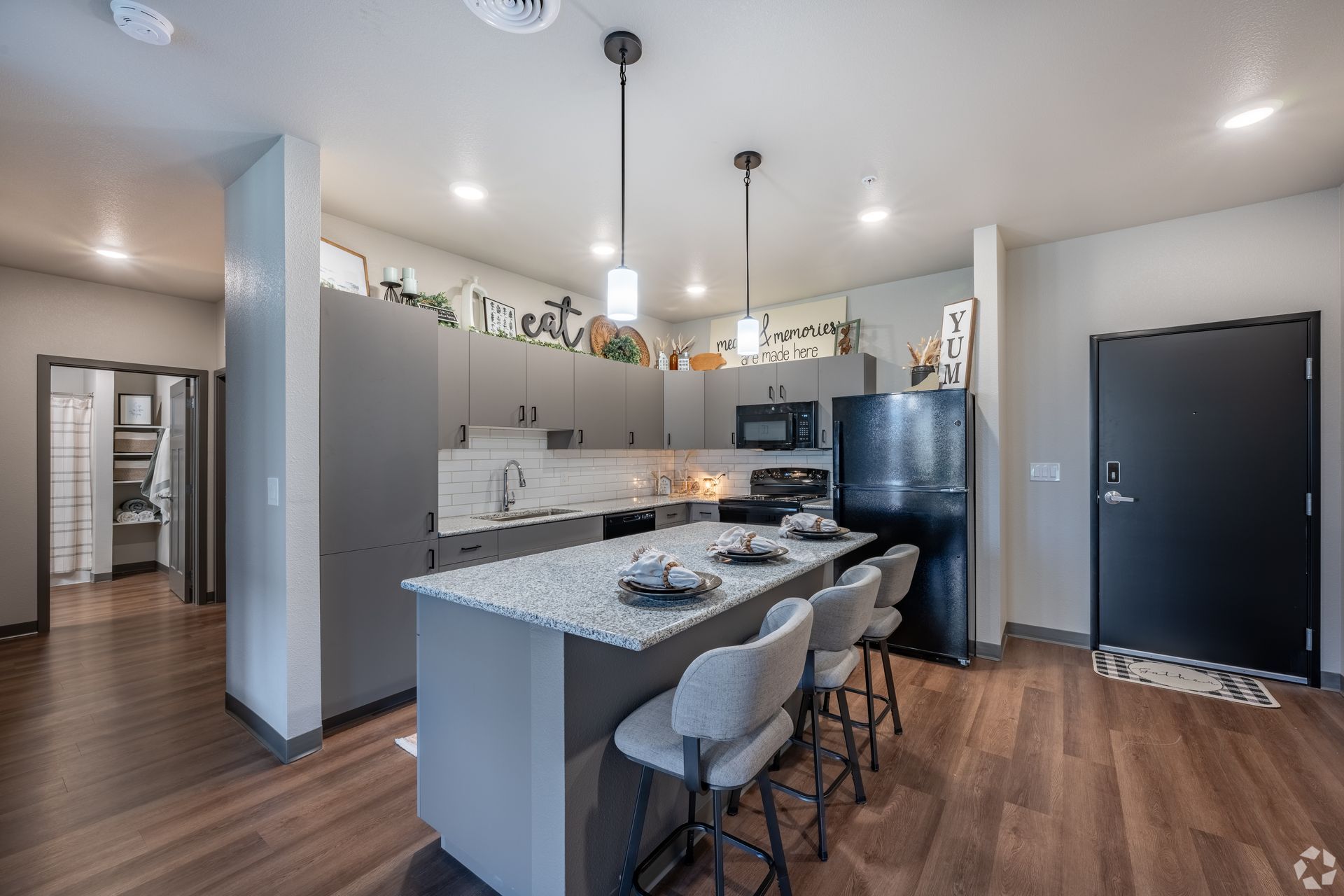 Apartment kitchen with grey cabinetry