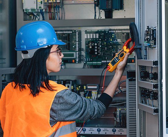 Woman Fixing Electric — Virginia Beach, VA — Mike Bertolino & Co. Woman Fixing Electric — Virginia Beach, VA — Mike Bertolino & Co.