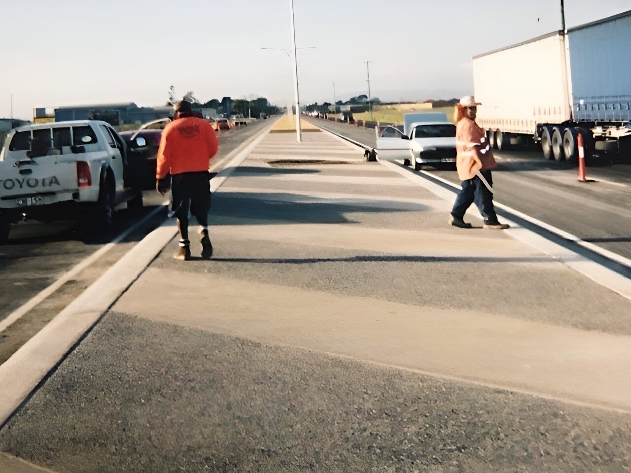 A Toyota Truck Is Parked On The Side Of The Road — Flash Concreting Pty Ltd In Nindaroo, QLD