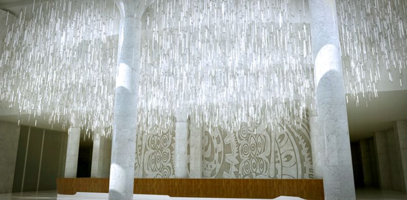 A lobby with a large chandelier hanging from the ceiling