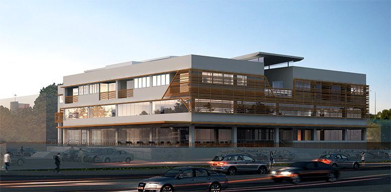 A building with a lot of windows and cars parked in front of it.