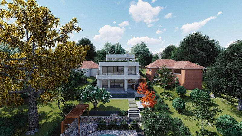 An aerial view of a house surrounded by trees and bushes.