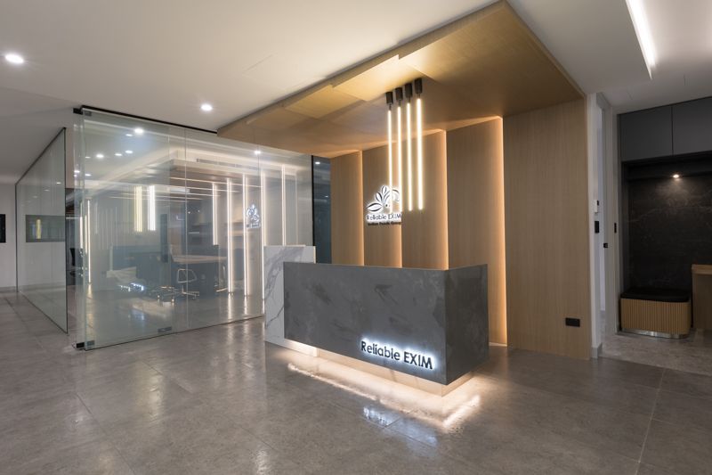 There is a reception desk in the middle of the room.