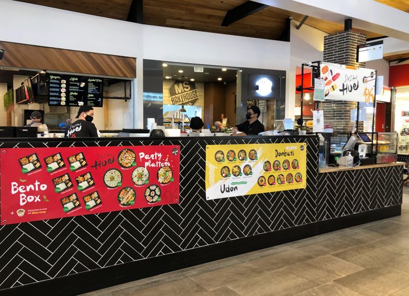 A restaurant with a sign that says bento box on it