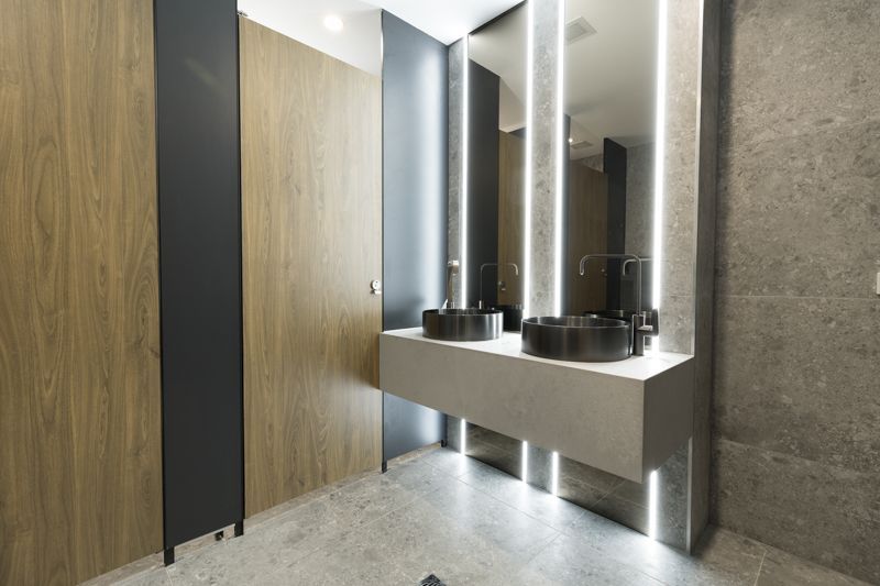A bathroom with two sinks and two mirrors.