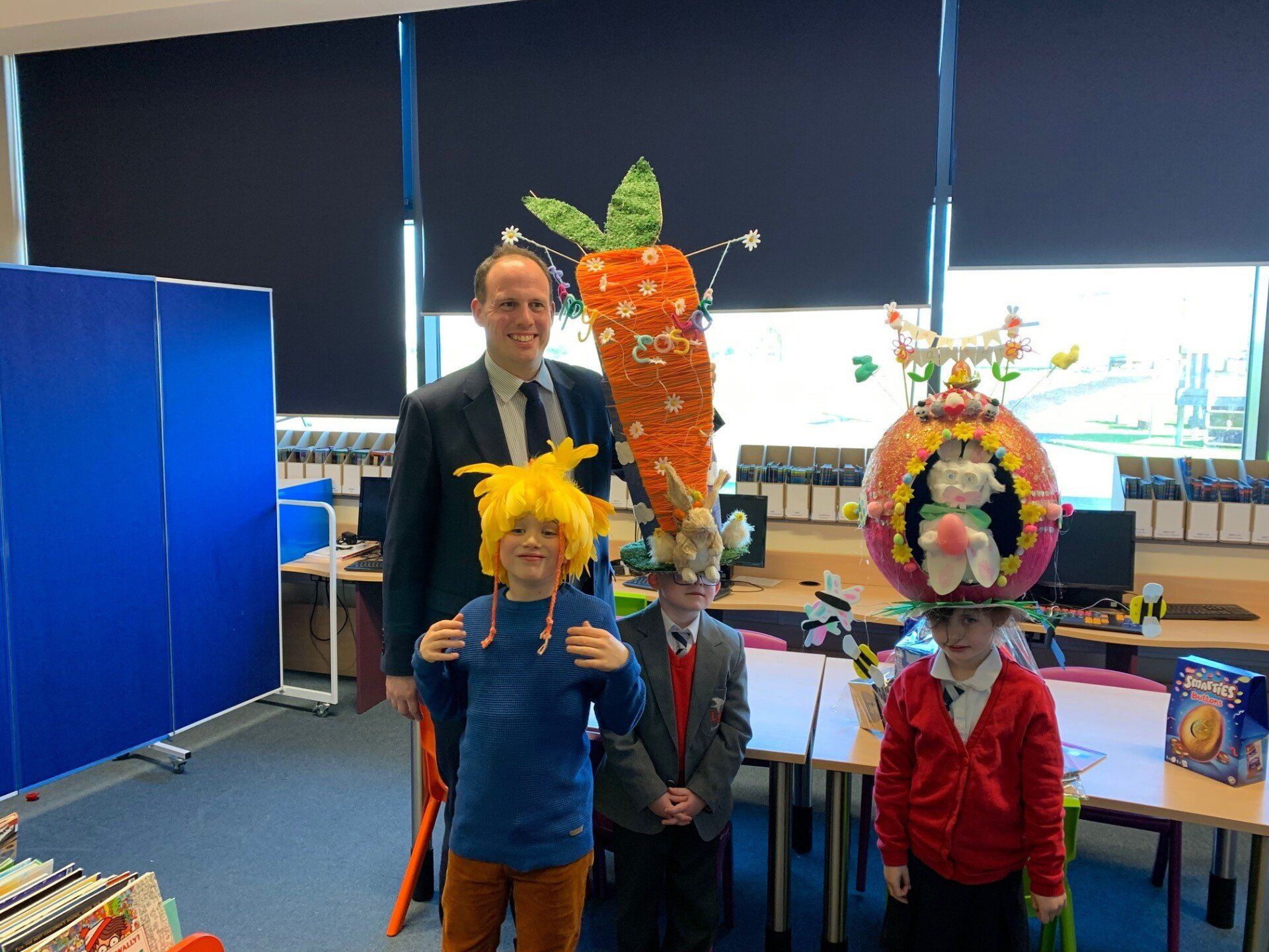 Buckingham MP Greg Smith with the three winners of the Easter Bonnet competition at Lace Hill Academy