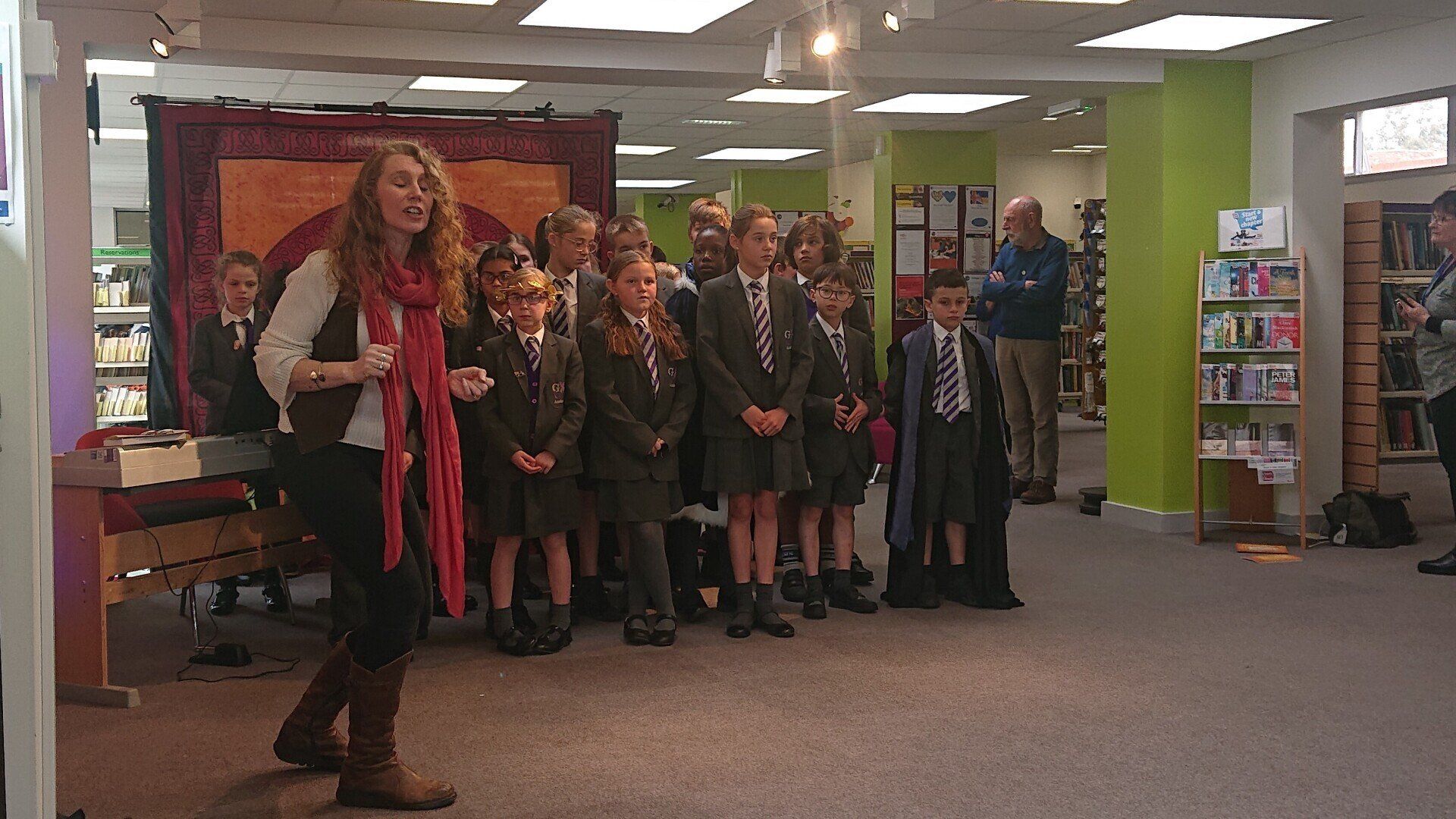 Founder of Red Phoenix Stories, Terrie Howey, with pupils from George Grenville Academy