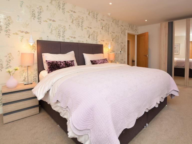 Beautiful master bedroom and feature wallpaper