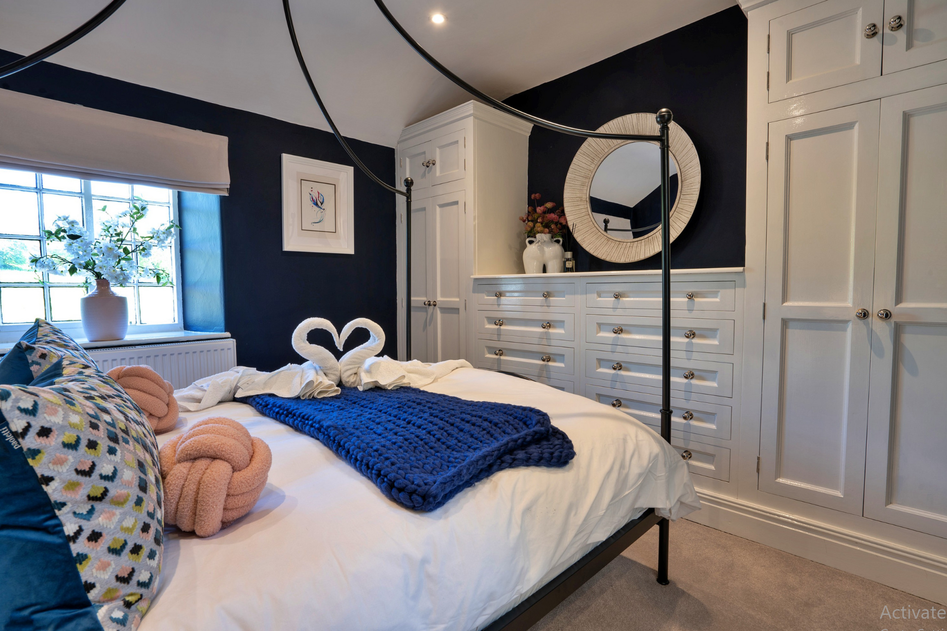 Master bedroom with frame bed and built in furniture