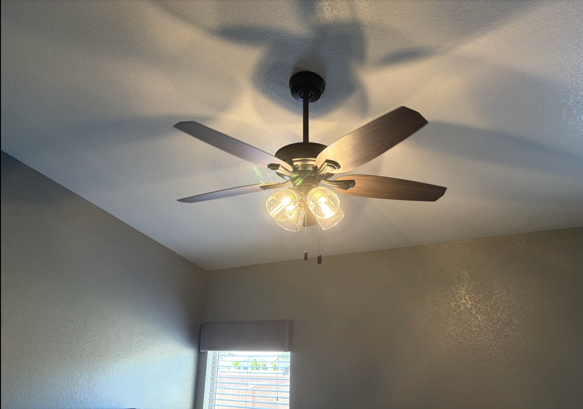 Covered patio with concrete floor, ceiling fans, recessed lights.. Lights and fans installed by For The People Electric.