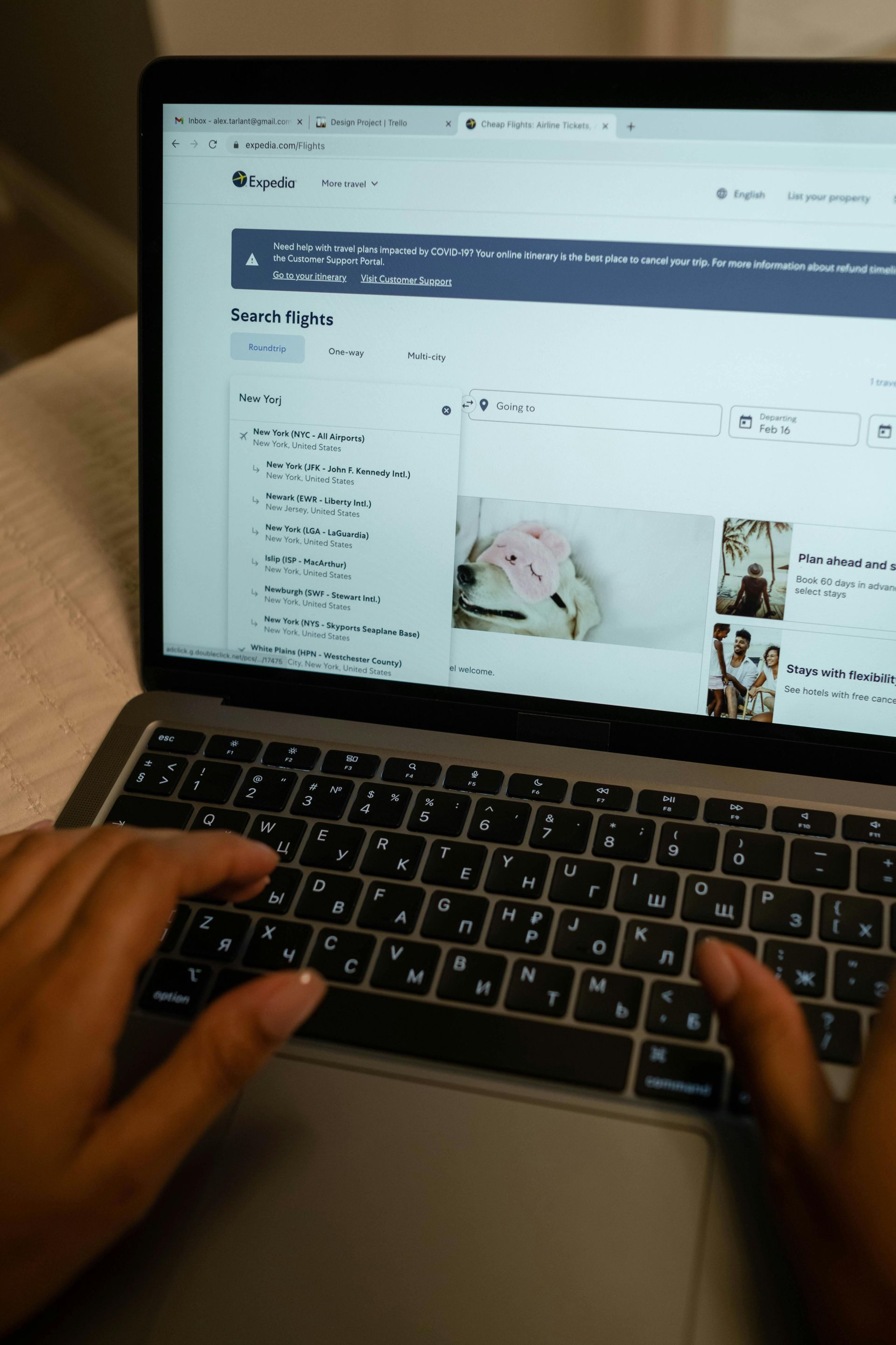 A person is typing on a laptop computer.