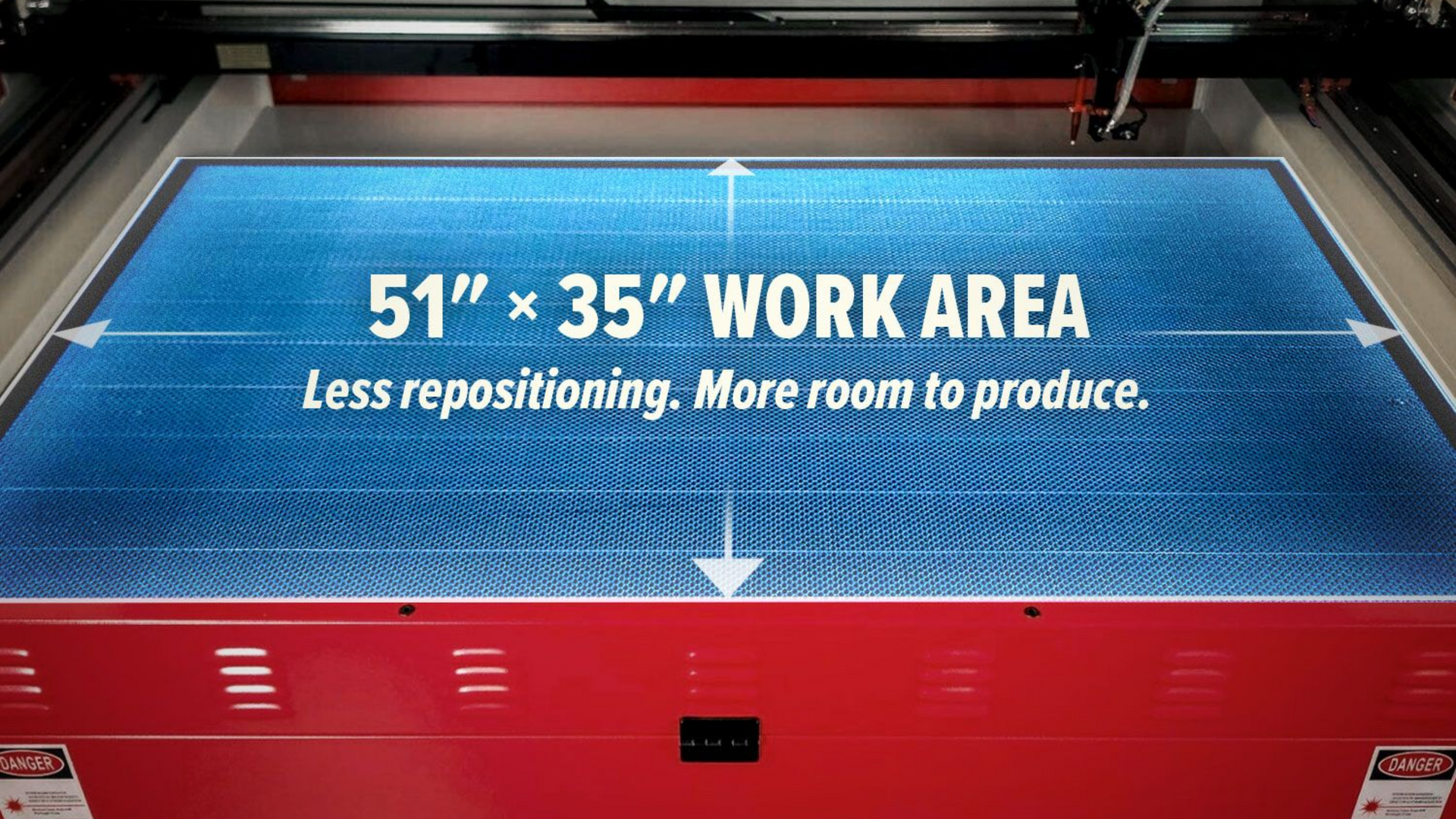 Inside view of a 1390 CO2 laser showing the 51 x 35 inch work area with room for larger projects and fewer repositioning steps.