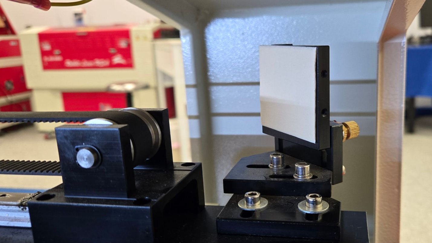 Mirror mount with masking tape target installed for laser beam alignment testing