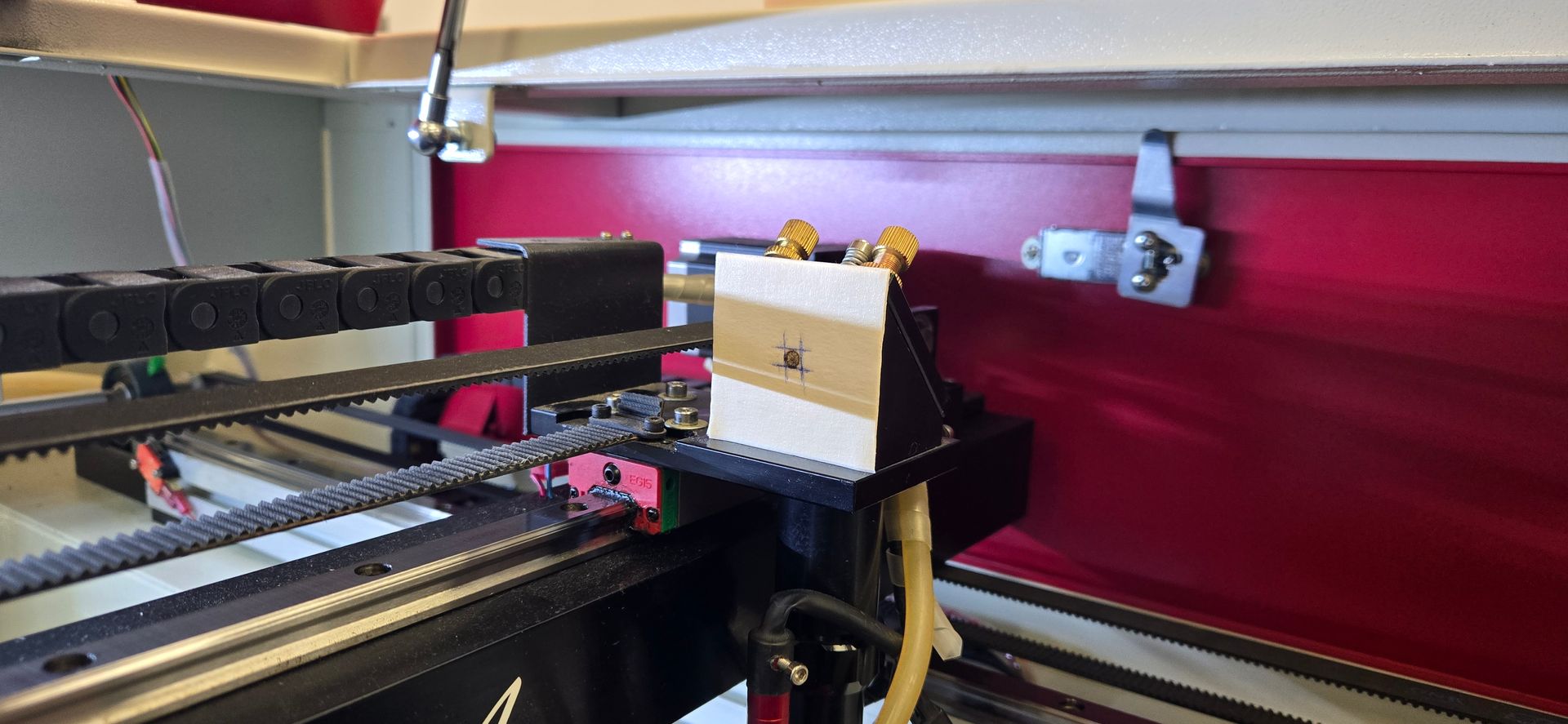 Side view of laser mirror target with marked alignment burn point
