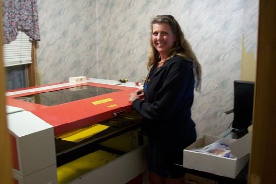 woman posing next to their rabbit laser usa machine 