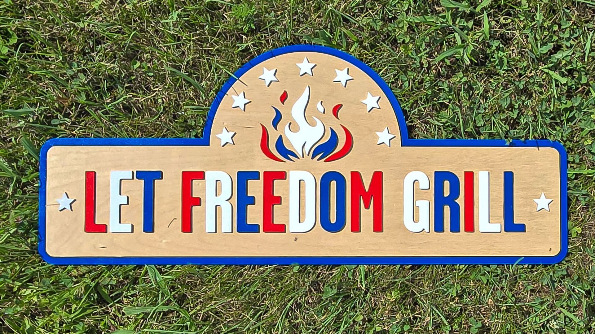 Patriotic wood sign reading 