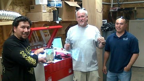 happy customers posing with their rabbit laser usa machine