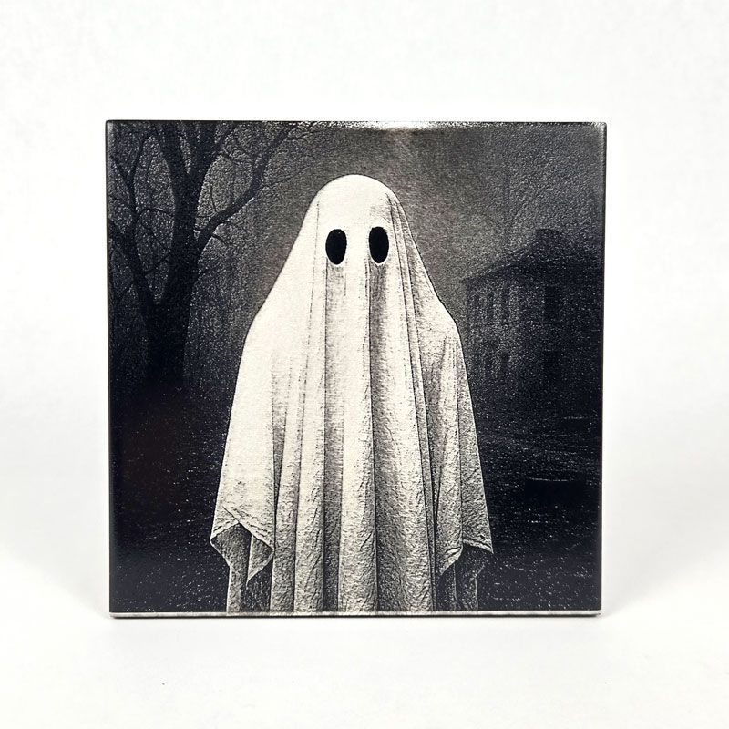 Engraved ghost image on a painted square tile.