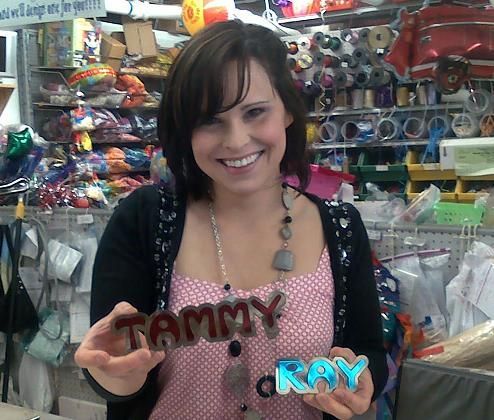 lady posing with a finished project from their rabbit laser usa machine