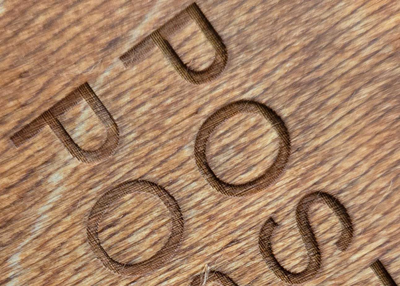 close up of wood stained after engraving
