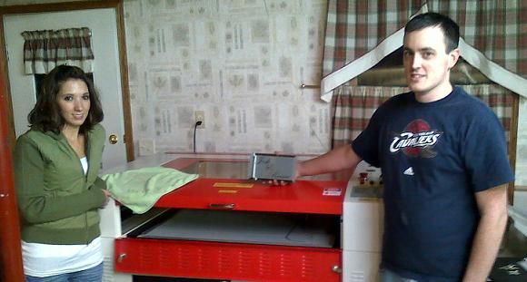 happy customers posing with their rabbit laser usa machine