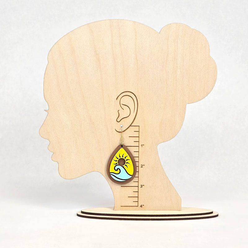 Wood earring display stand with hanging sunset teardrop earring and size guide.