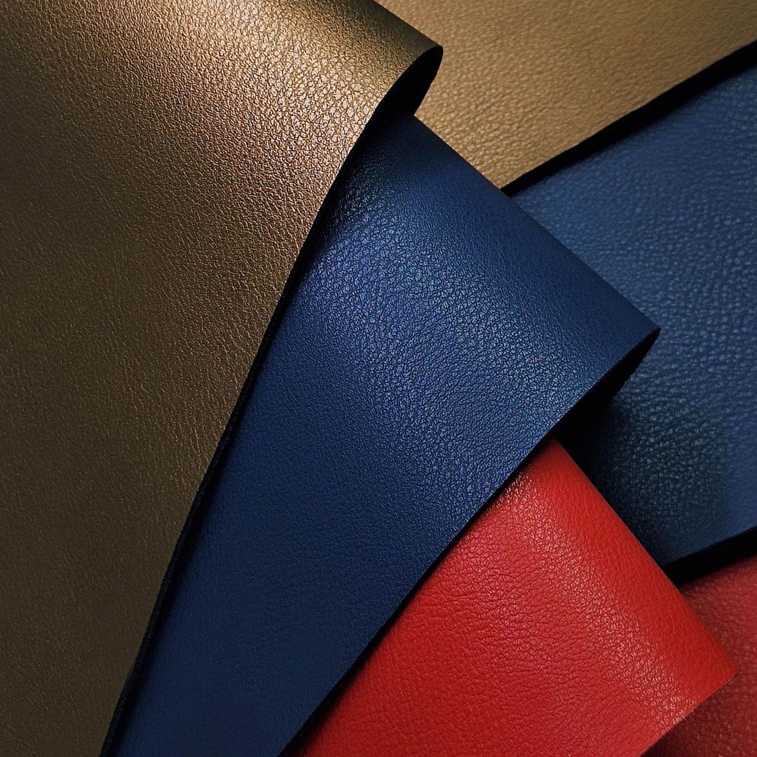 Sheets of synthetic leather in multiple colors used for laser engraving and cutting projects