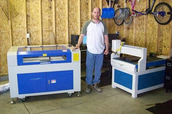 man posing next to their rabbit laser usa machine 