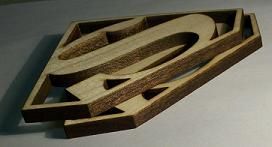 superman logo laser cut out of wood by rabbit laser usa machine