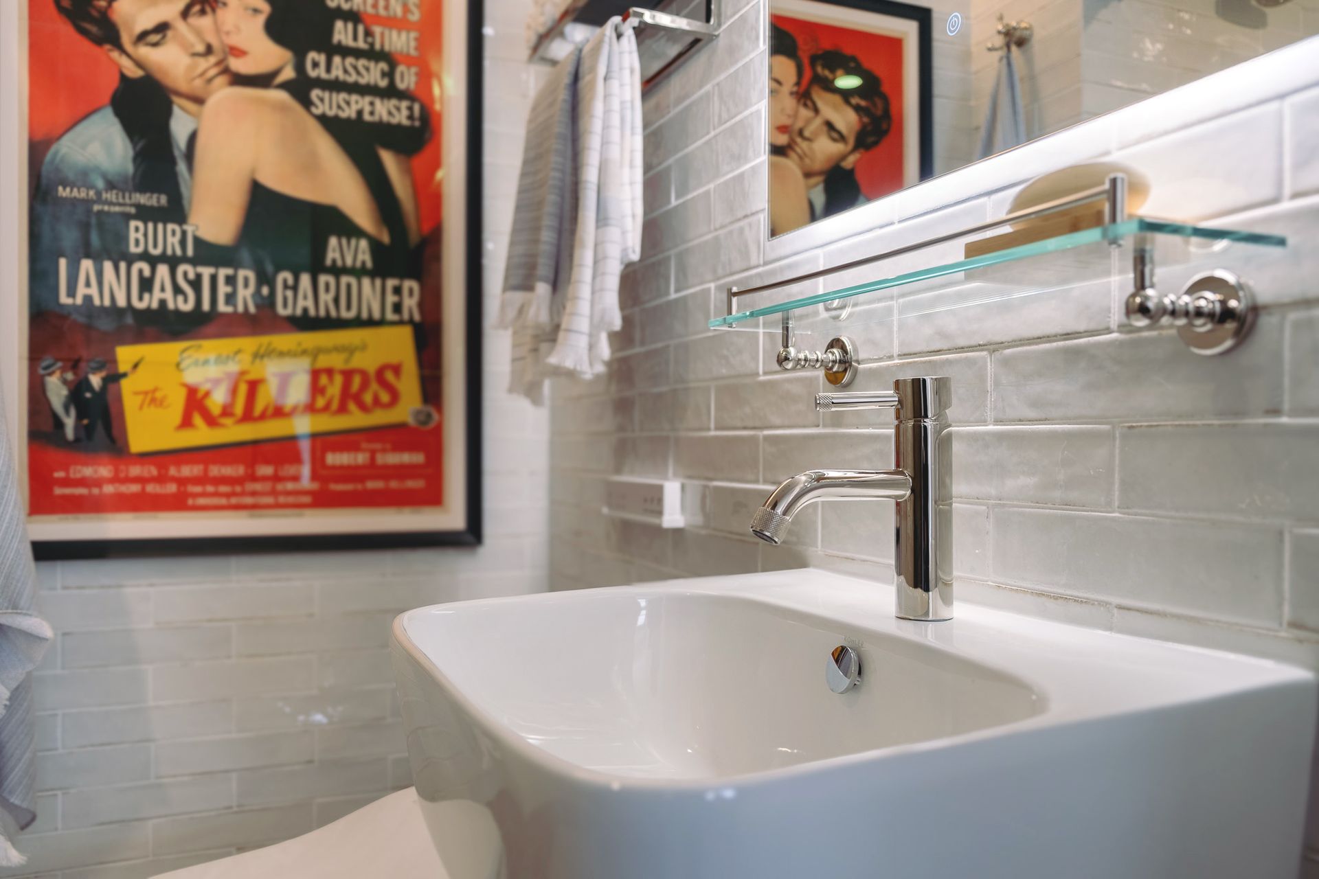 Bathroom with a sink with a silver faucet.