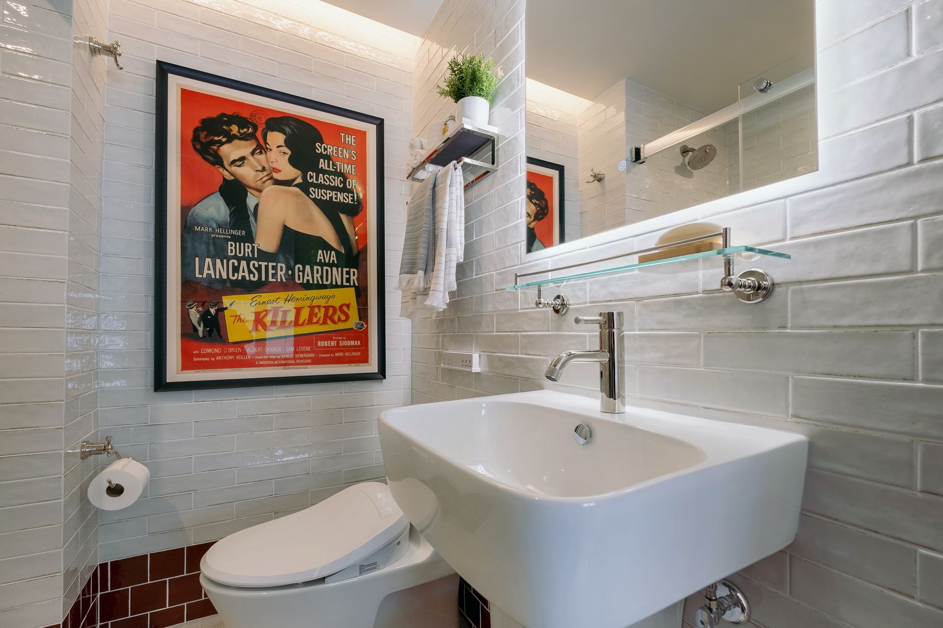 A bathroom with a sink and toilet.