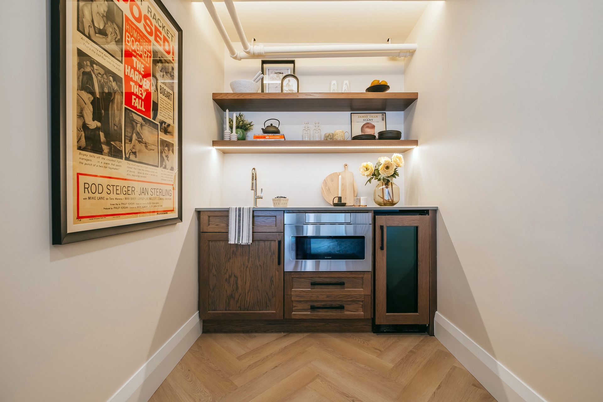A kitchen with stainless steel appliances and wooden cabinets.
