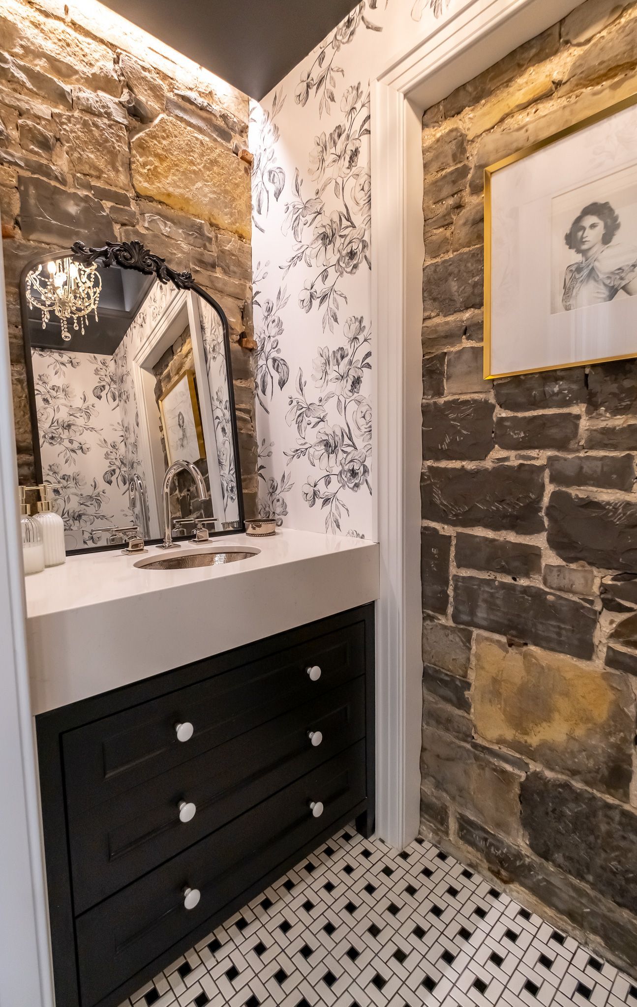 A bathroom with a sink and mirror
