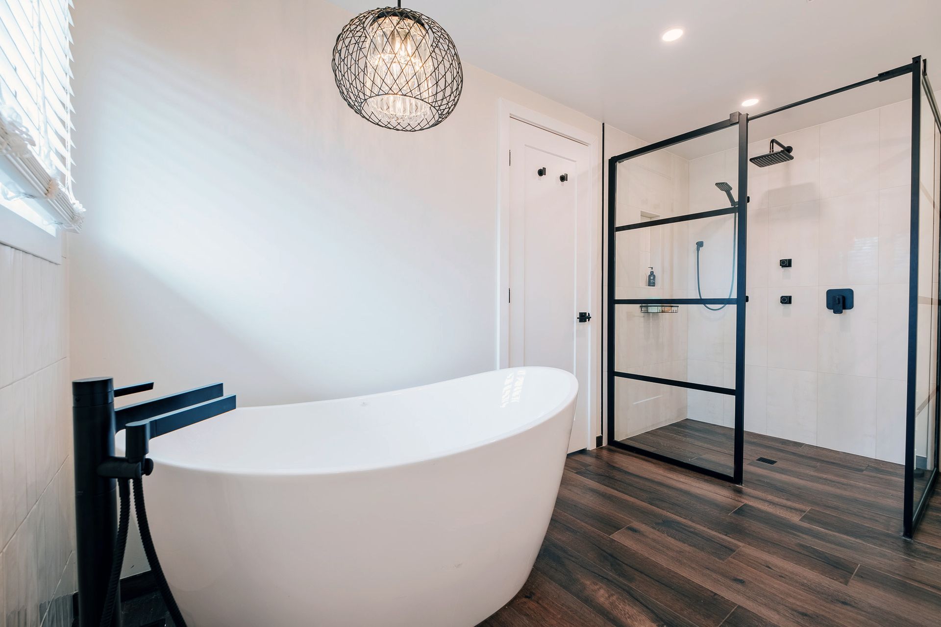 A bathroom with a bathtub and a walk in shower.