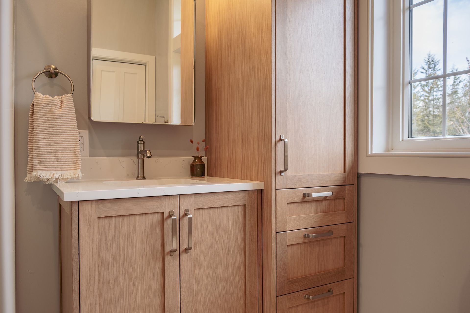 A bathroom with a sink on a vanity.
