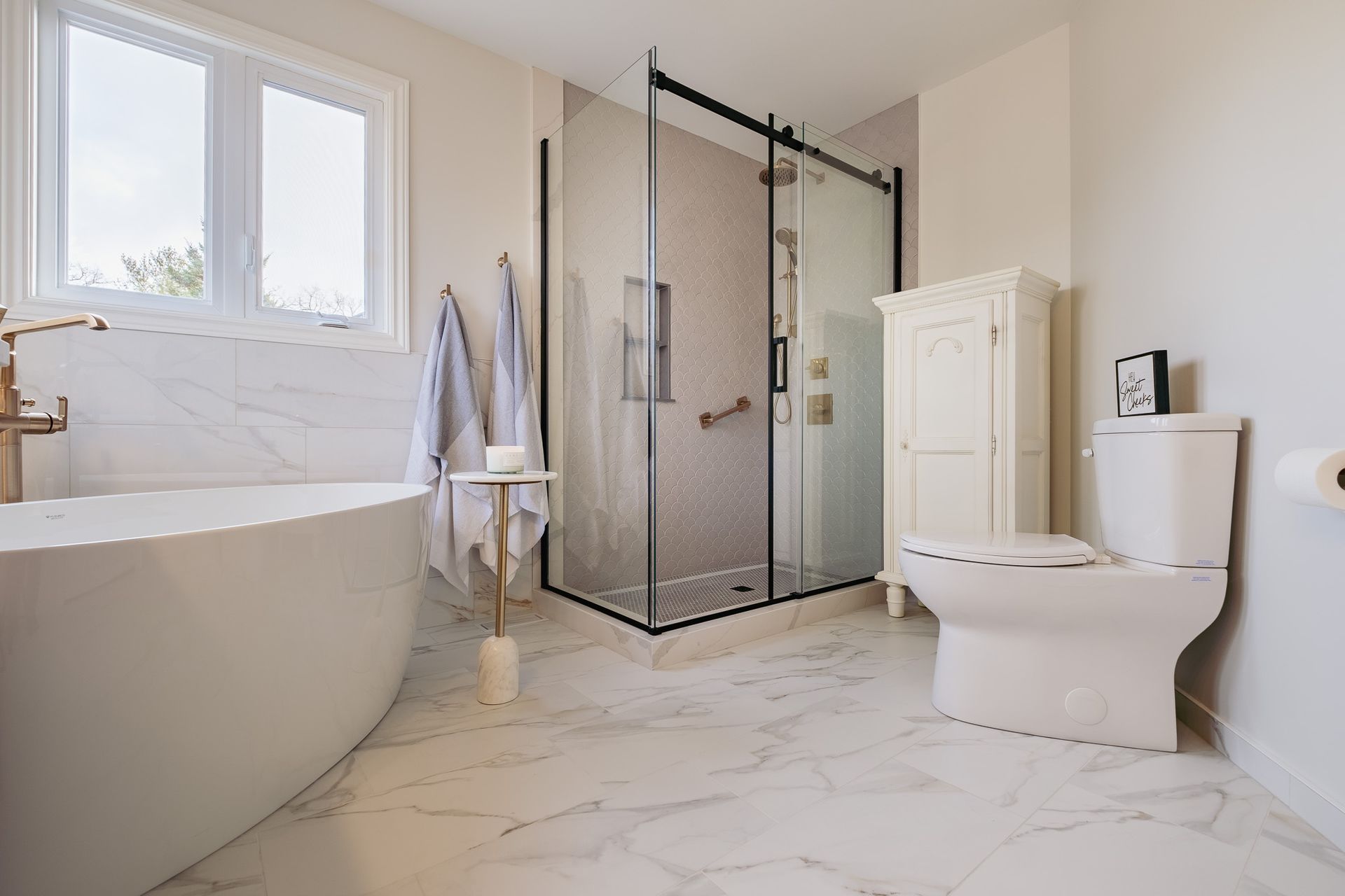 A bathroom with a bathtub, toilet, and shower.