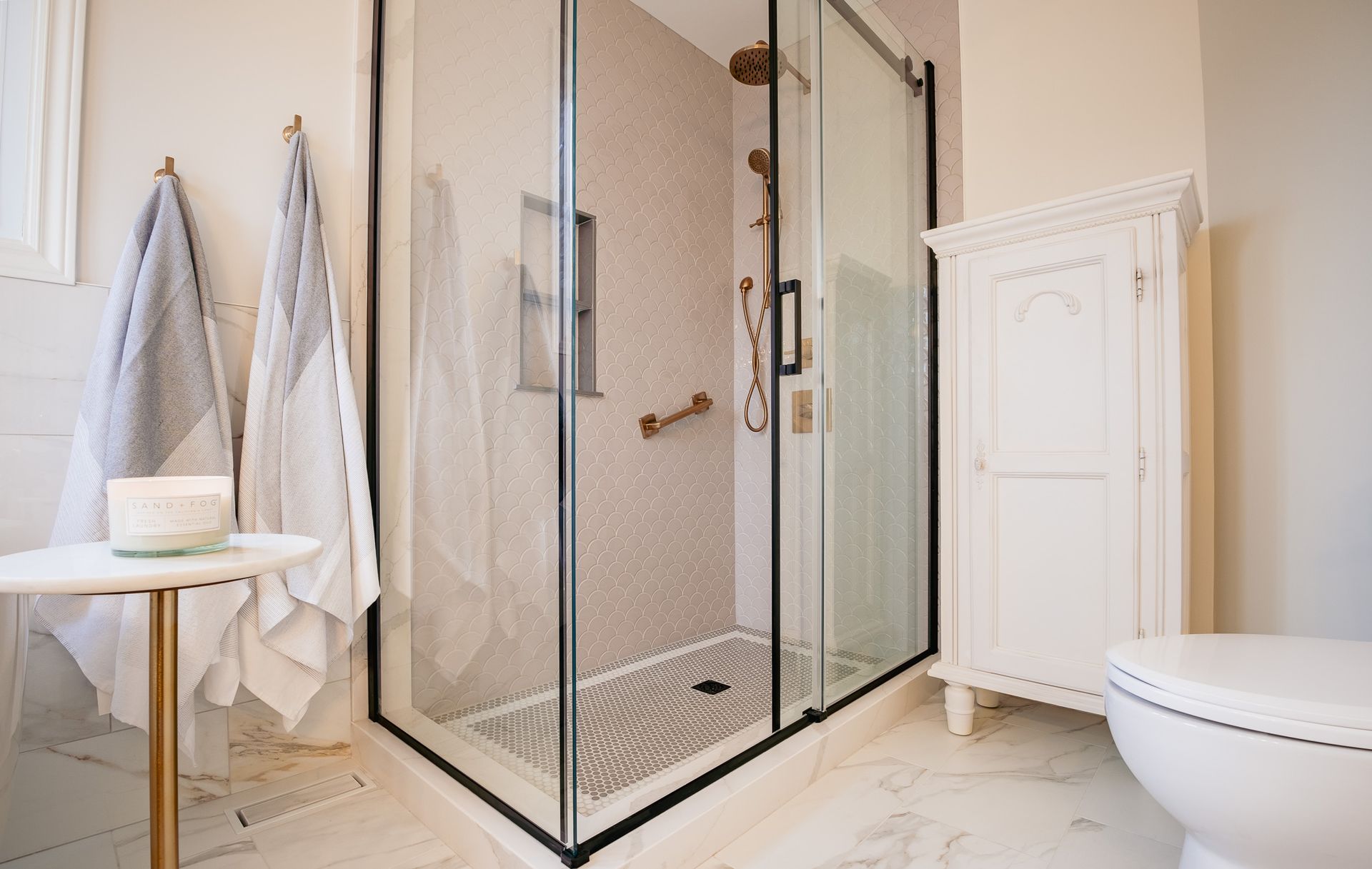 A bathroom with a walk in shower and a toilet.