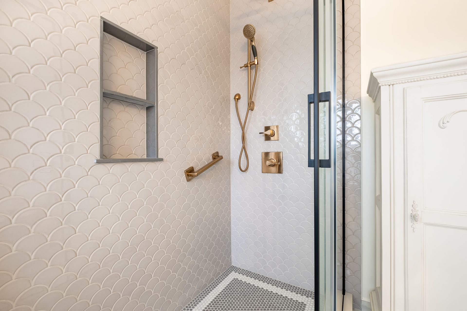 A bathroom with a walk in shower.