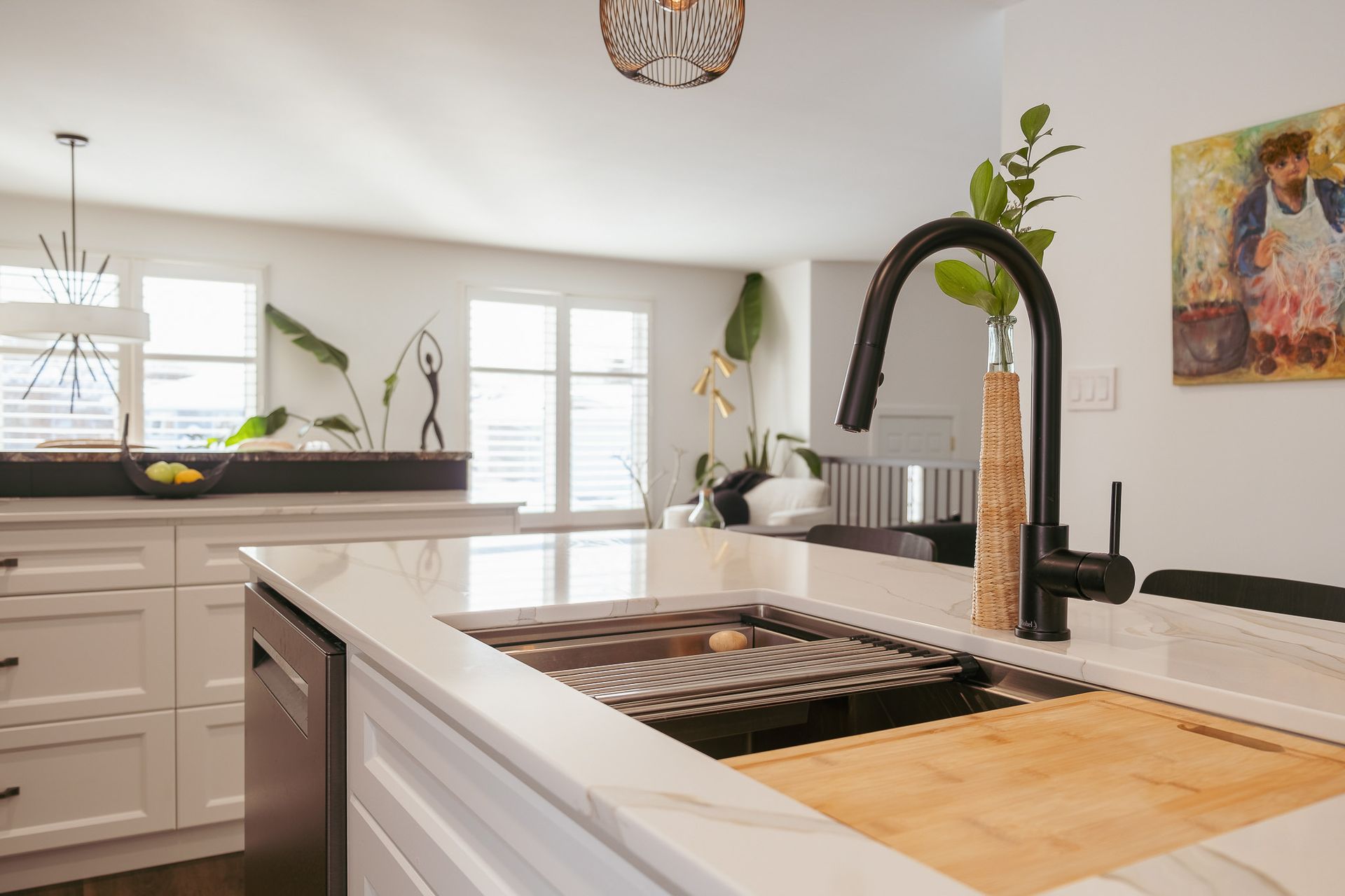 A kitchen with a sink and a dishwasher.