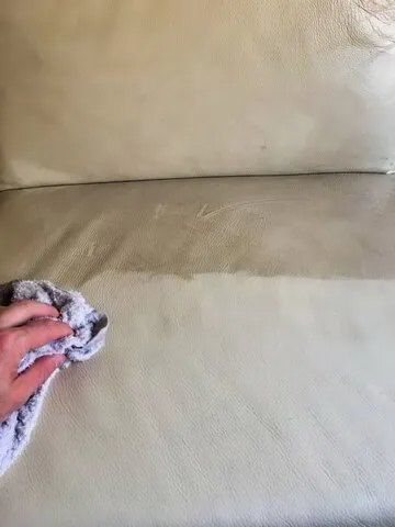 A Person is Cleaning a Couch With a Towel  — Carpet Pro Care in Goonellabah, NSW