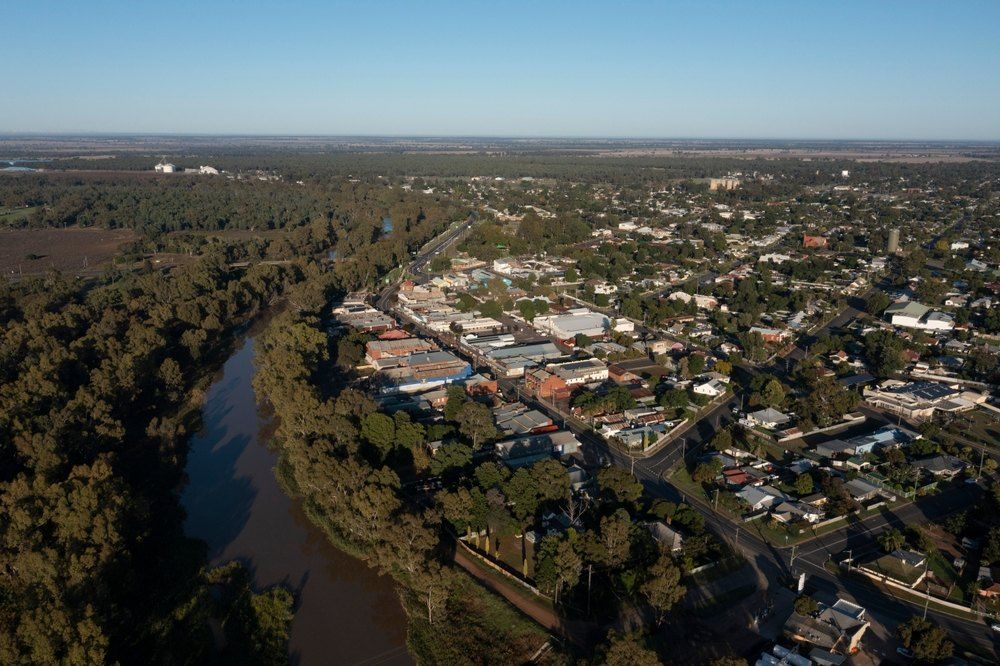 An Aerial View of a City Surrounded by Trees and a River — Carpet Pro Care in Goonellabah, NSW
