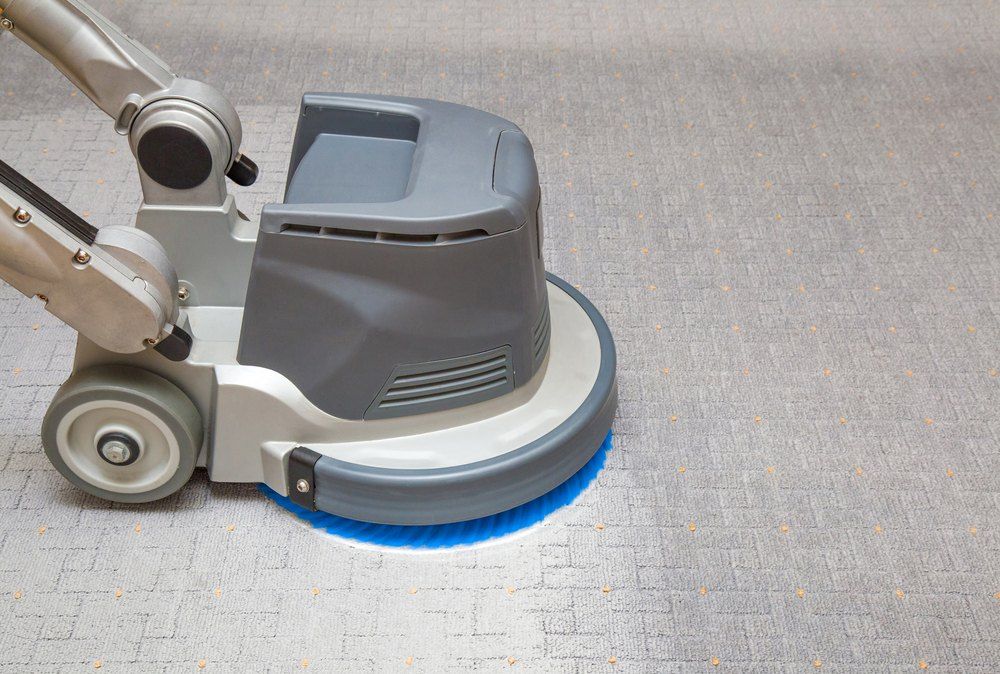 A Person is Using a Machine to Clean a Carpet — Carpet Pro Care in Kyogle, NSW