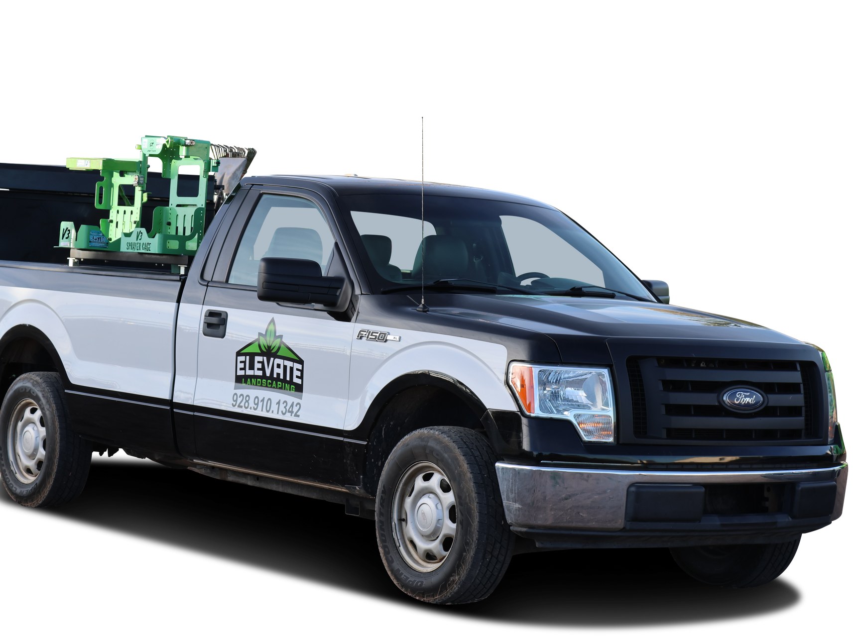 A two-toned black and white Ford pickup truck with a green logo on the door and green equipment in the truck bed.