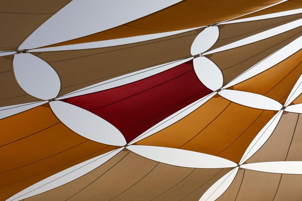 A Red Square is Surrounded by Brown and White Circles — Cooloola Sail Company In Tamaree, QLD
