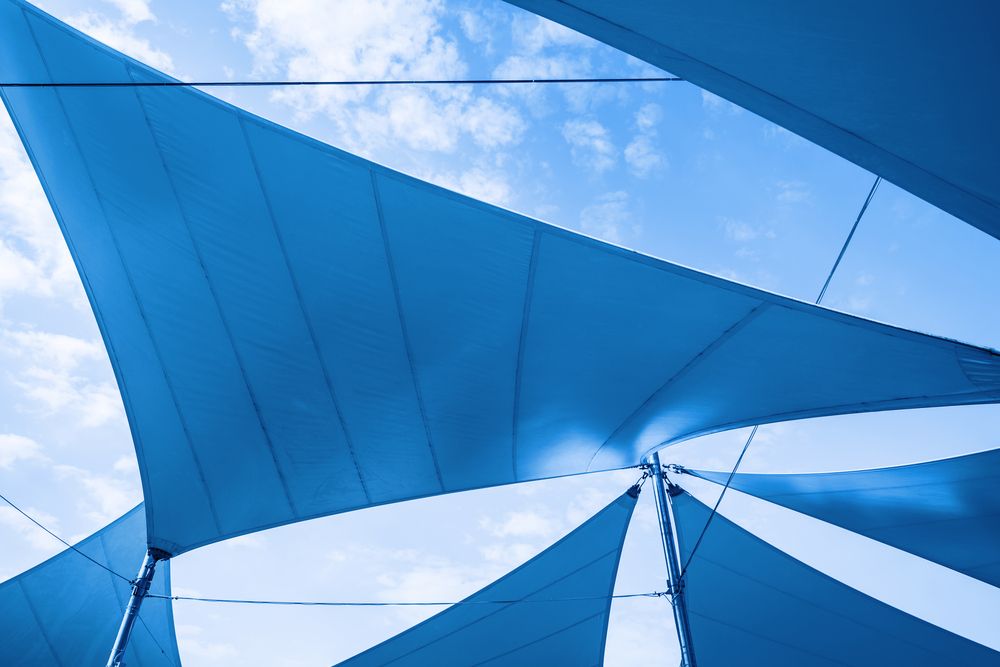 Blue and White Umbrella Against a Blue Sky — Cooloola Sail Company In Eumundi, QLD