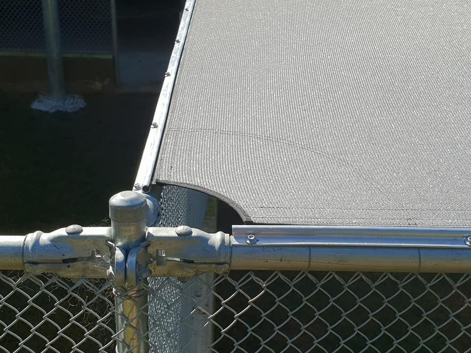 A Chain Link Fence With a Canopy Attached to It — Cooloola Sail Company In Tin Can Bay, QLD