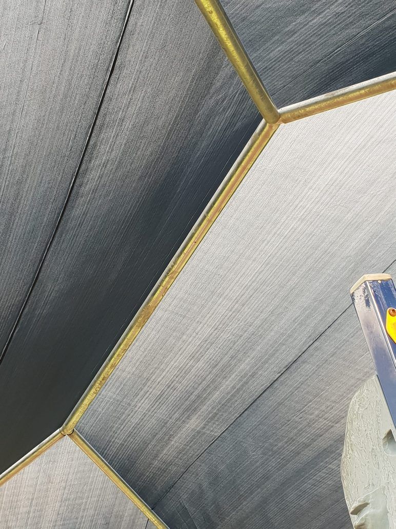 A Close Up of a Tile Wall With a Gold Trim — Cooloola Sail Company In Rainbow Beach, QLD