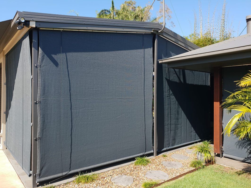 A House With a Screen on the Side of It — Cooloola Sail Company In Southside, QLD