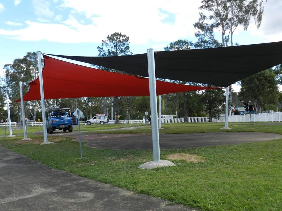 A Car is Parked Under a Red and Black Umbrella — Cooloola Sail Company In Southside, QLD