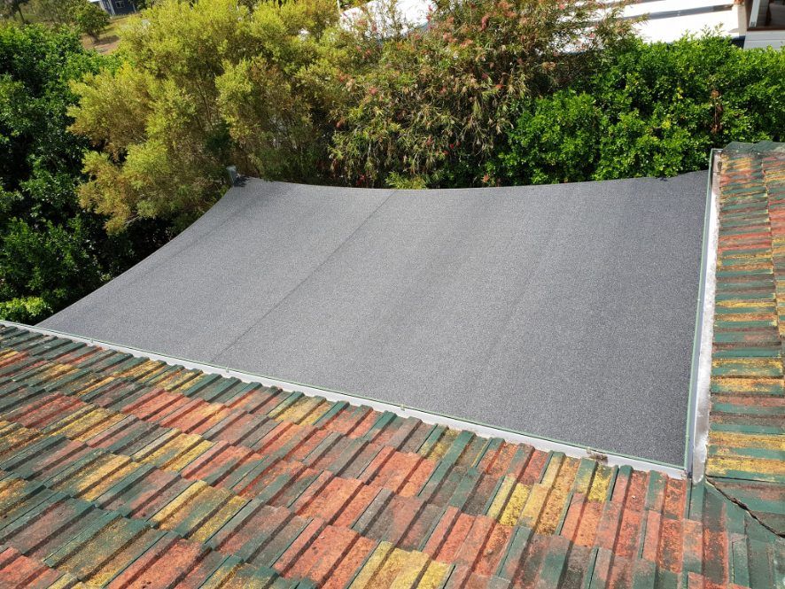 A Roof With a Gray Roofing Material on It — Cooloola Sail Company In Glenwood, QLD
